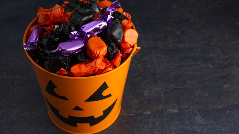 black and orange candy in halloween pale