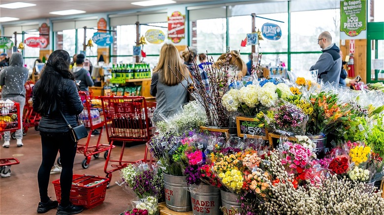 shoppers in a busy trader joe's store