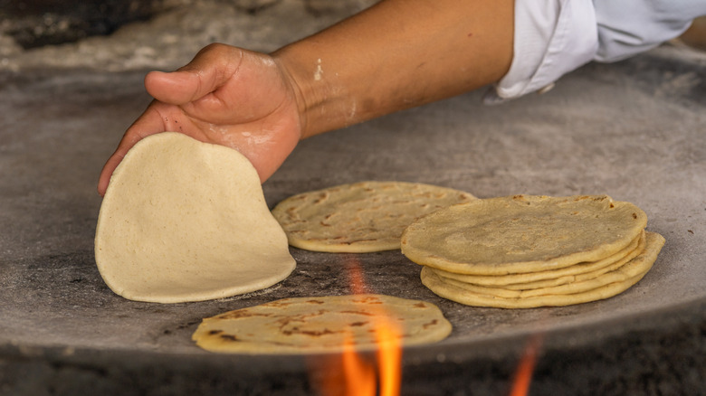 Corn tortillas being cooked 