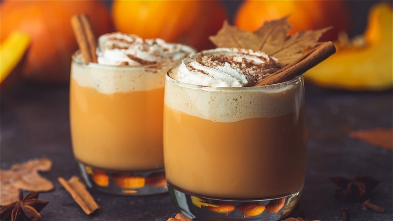 pumpkin spiced lattes in clear mugs