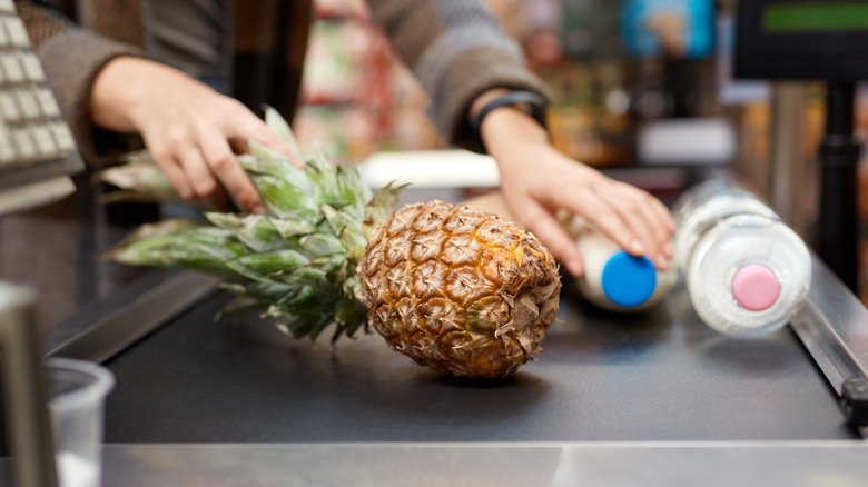 Food on grocery conveyor belt