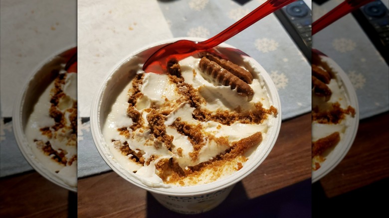 Container of viral Japanese cheesecake with red plastic spoon