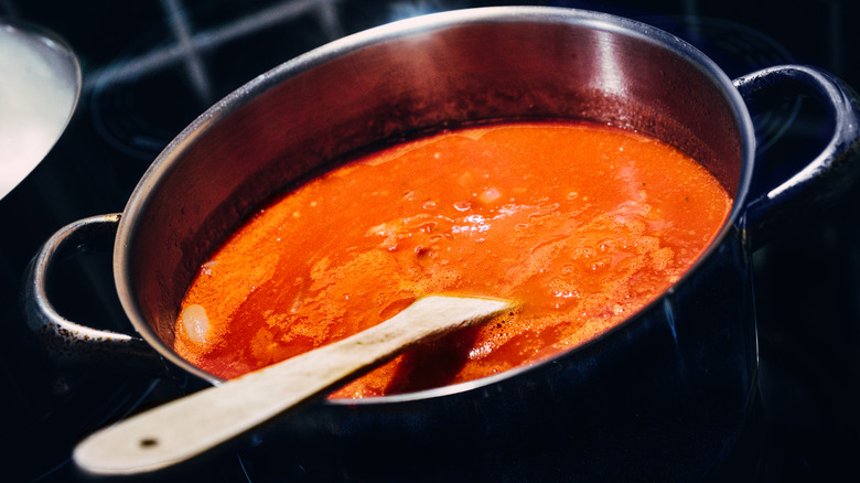 Pot of red sauce on stove