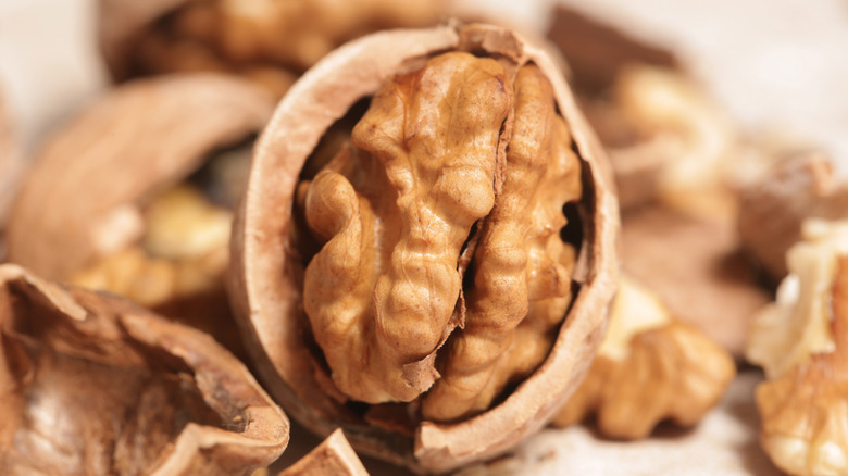 A half of a walnut still in the shell.