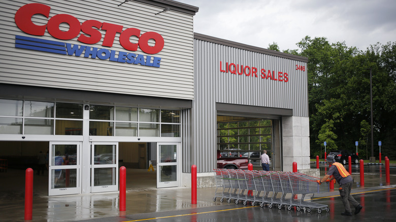 man pushes shopping carts at Costco