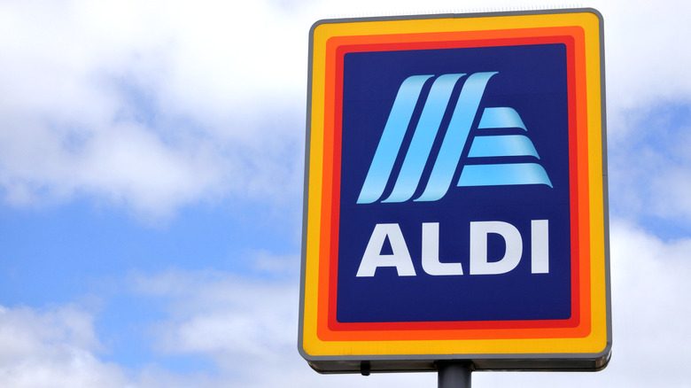 Aldi sign against blue sky