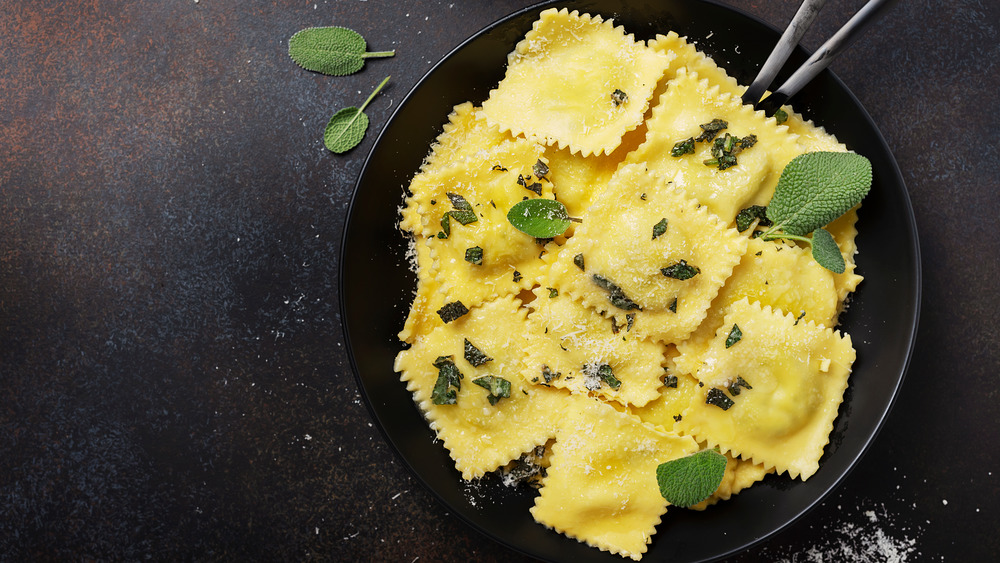 Bowl of ravioli with sage and cheese