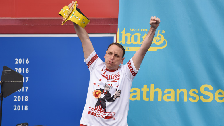 Joey Chestnut with arms up in victory