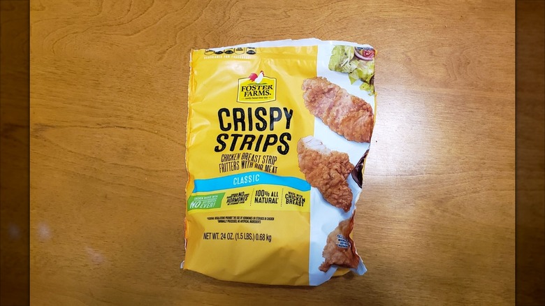 Bag of Foster Farms crispy chicken strips on table