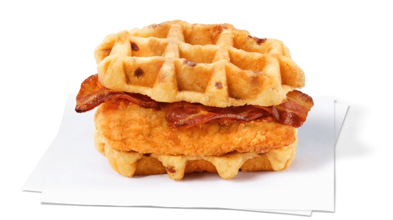 A chicken and waffle breakfast sandwich with bacon from Chick-fil-A.