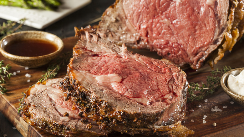 prime rib served on cutting board with au jus