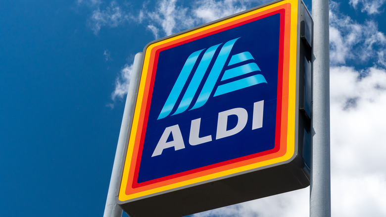 Aldi sign against blue-sky background