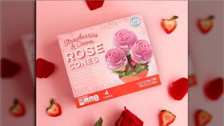 Strawberries and cream rose cones on pink background