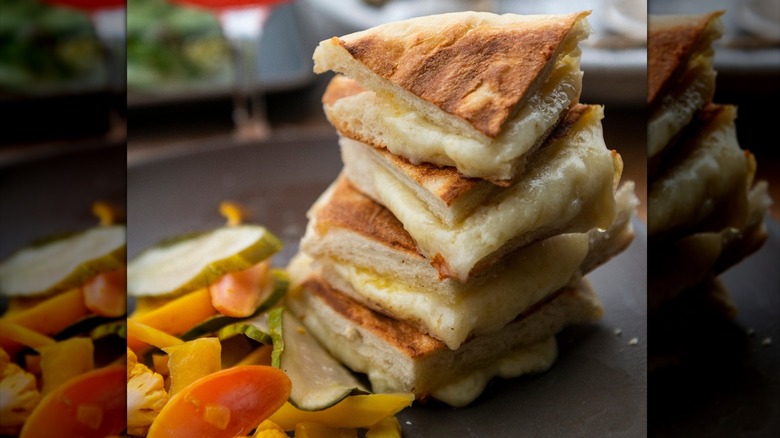 A stack of grilled cheese in pieces