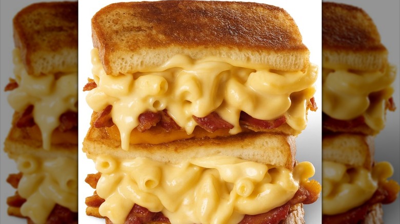 Grilled cheese split in half with meat