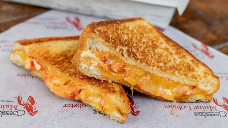Grilled cheese split in half oozing cheese