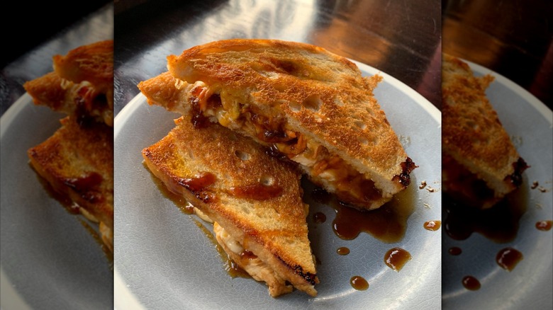 grilled cheese split in the half on a plate