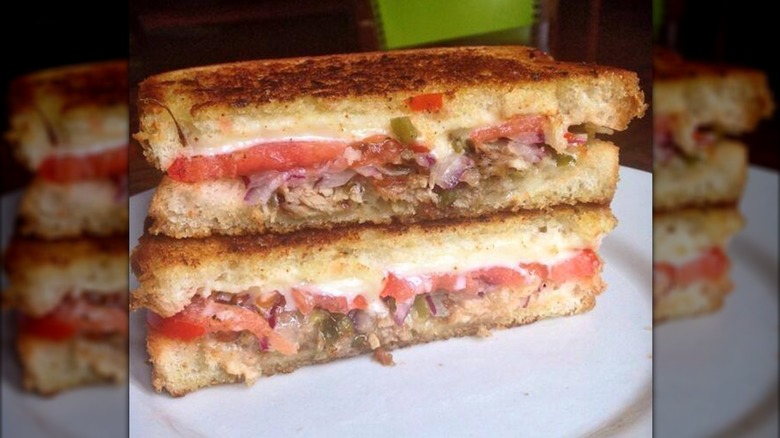 grilled cheese split in half, one half stack on top of the other