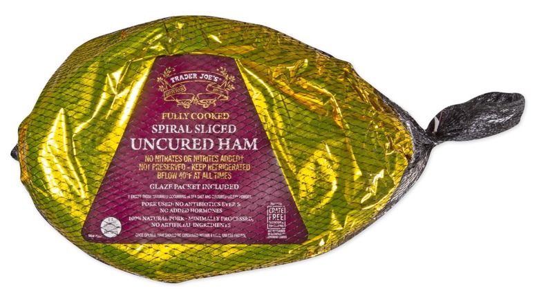 Trader Joe's wrapped spiral sliced ham on black background