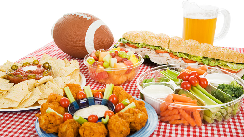 Appetizer spread with football and beer