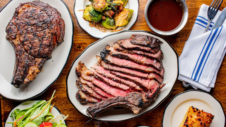 steakhouses dishes spread out on table