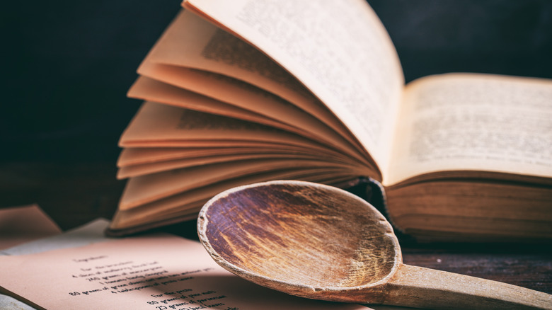 Generic cookbook with wooden spoon