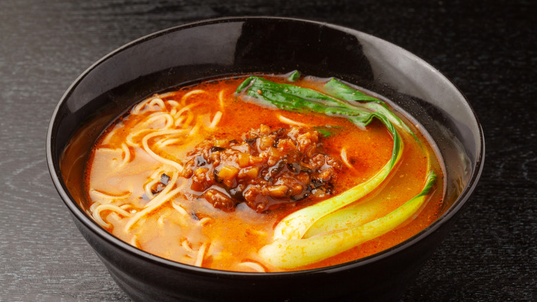 Dandan noodles in a dark bowl