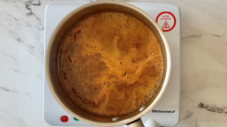 Simmering sauce in saucepan