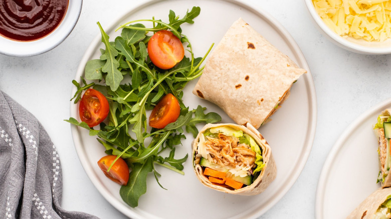 Chicken wrap on plate with salad