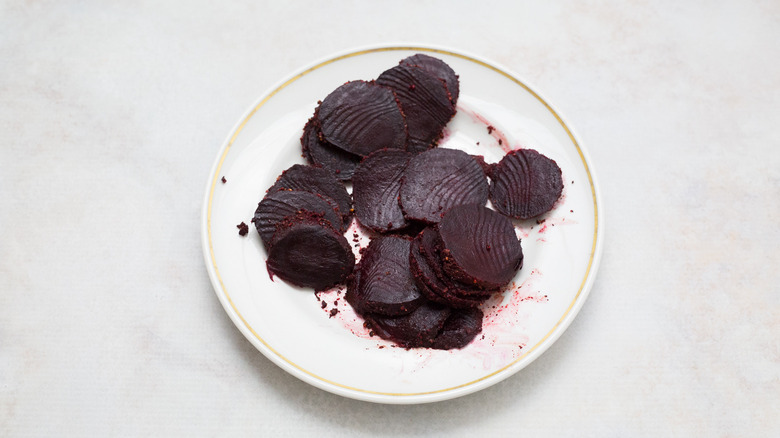 sliced beets on white plate