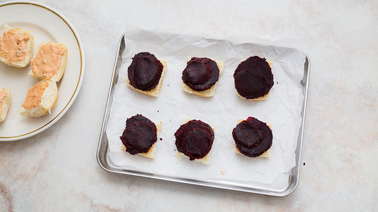 rolls with beets on pan