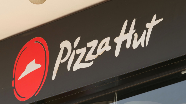 A close-up of a Pizza Hut sign