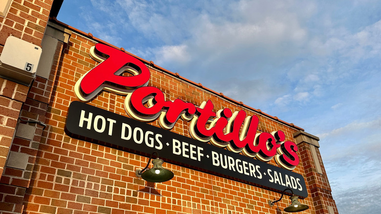 Portillo's brick building under a cloudy sky
