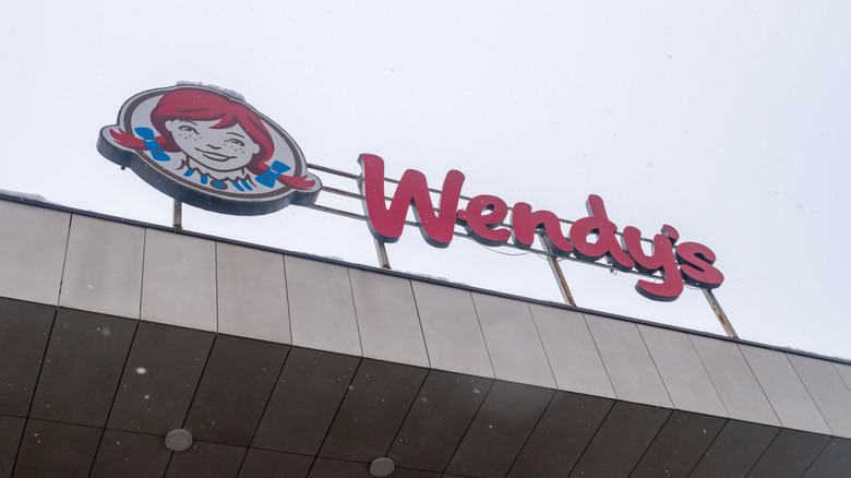 A low angle of Wendy's sign on a restaurant