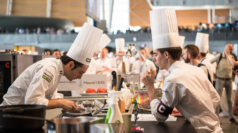 Chefs working in kitchen