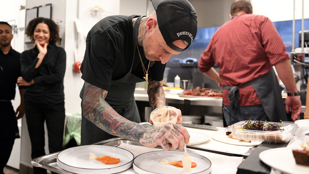 Michael Voltaggio setting a plate