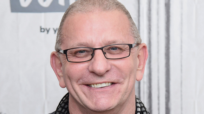 Robert Irvine smiling in glasses