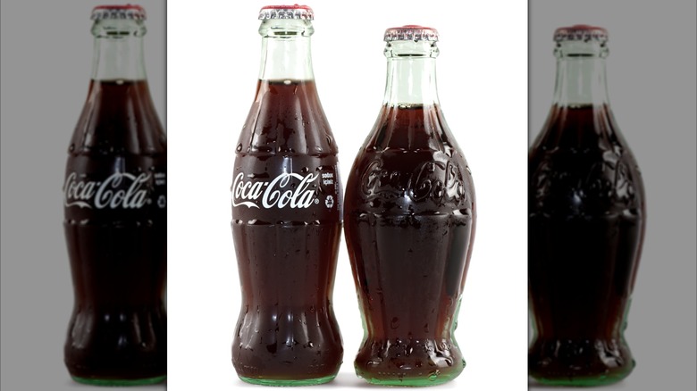 Pair of vintage Coke bottles