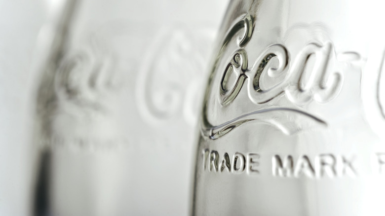 Close-up of embossed Coke logo