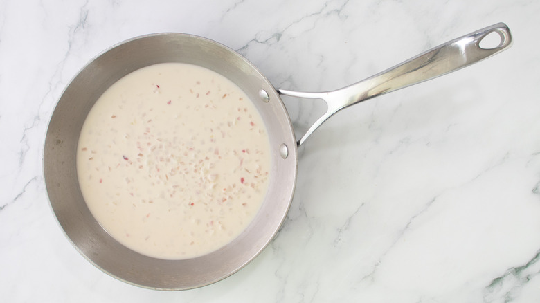 beer and cream sauce in skillet on marble surface