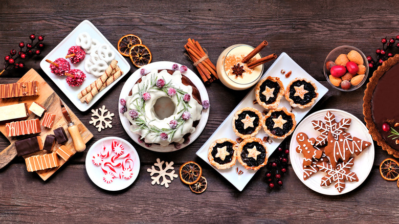 Holiday desserts laid out on wood table
