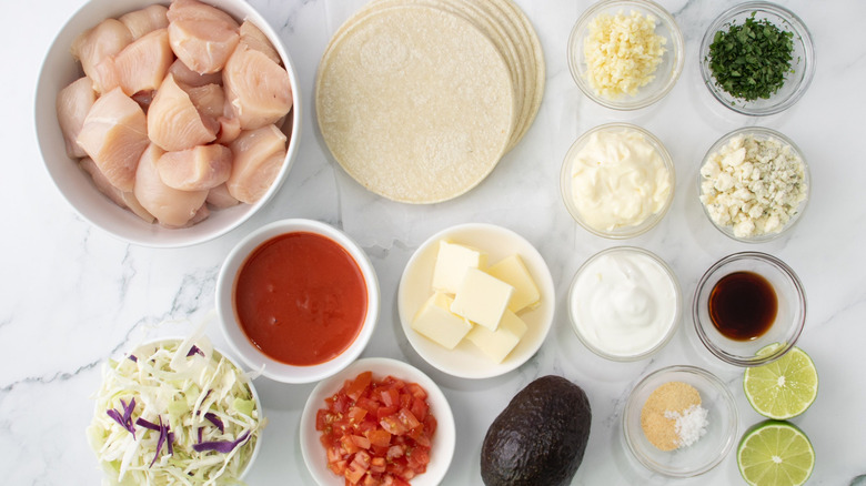 Ingredients for Buffalo chicken tacos and avocado blue cheese dressing
