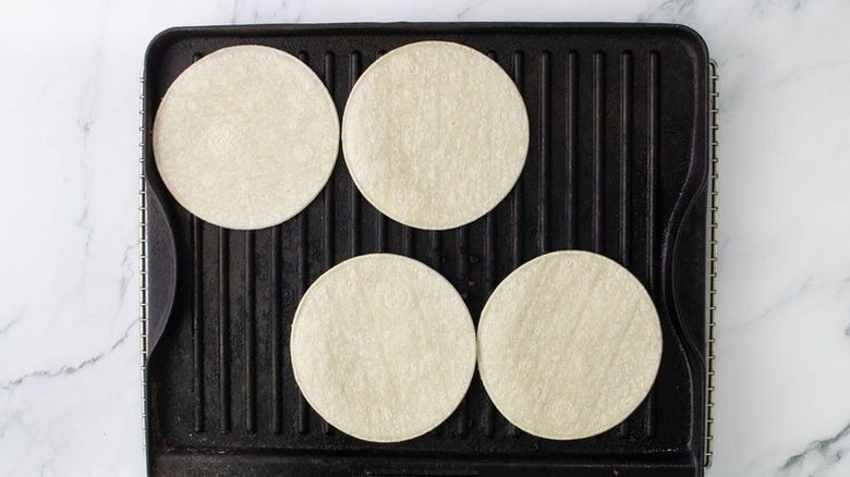 Corn tortillas on grill pan