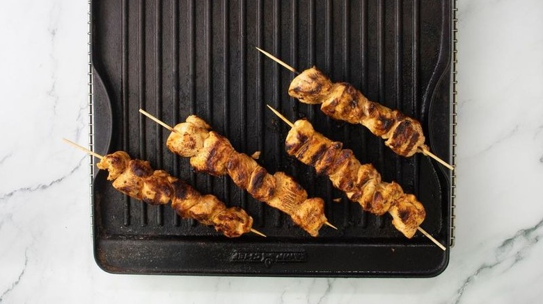 Chicken skewers on grill pan