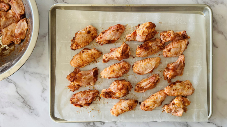 Chicken wings on baking sheet