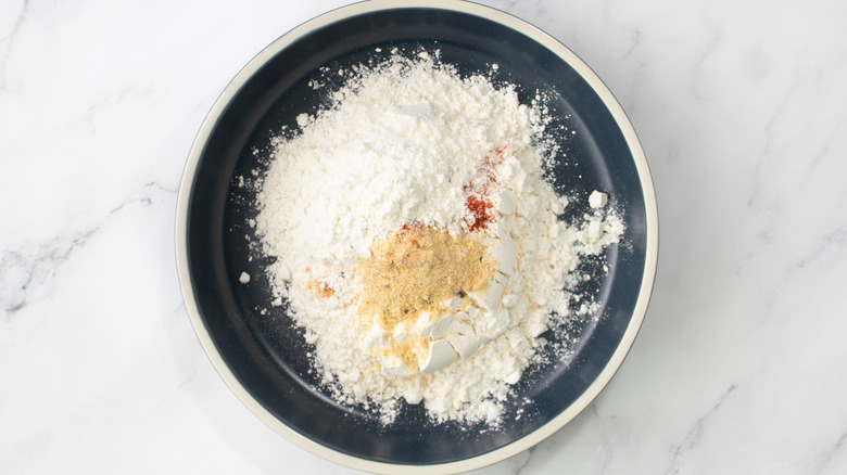 flour and seasonings in a black bowl