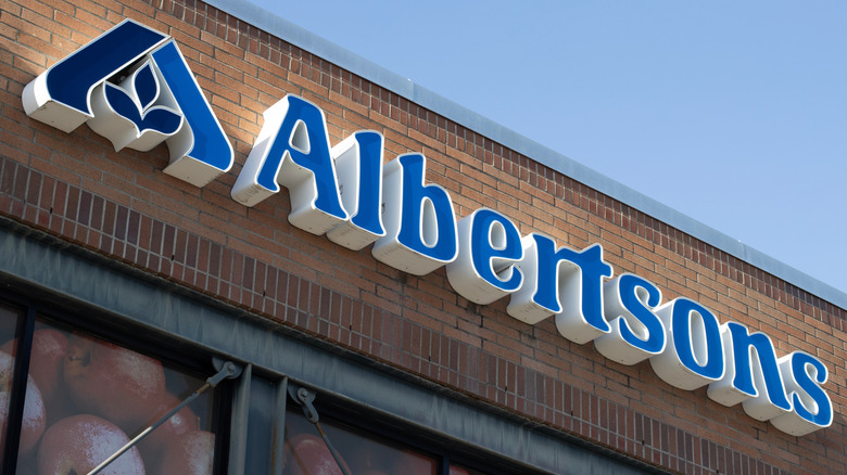 Albertsons grocery store signage is pictured against a brick facade