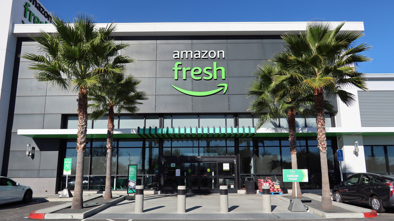 Amazon Fresh grocery store entrance framed by palm trees
