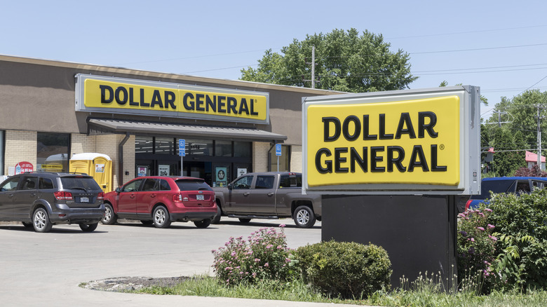 Cars parked outside of a Dollar General store