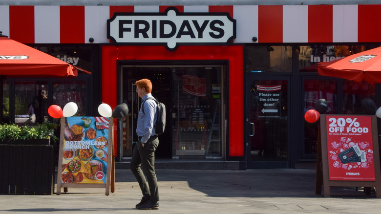 A man walks by a TGI Fridays